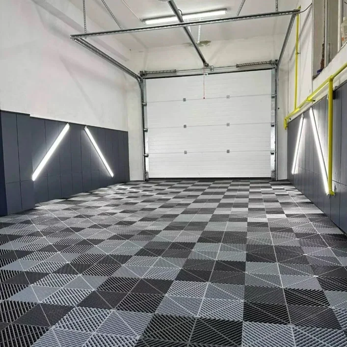 Single garage with a grey and black checkerboard tile floor